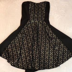 little black dress with gold details